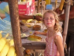 Darcy putting lemon on her corn